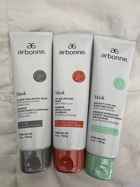 Arbonne Mask Trio – White Tubes with Red, Gray, and Green Accents